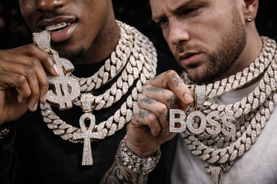 urban lifestyle image featuring iced out chains and statement jewelry worn by modern artists